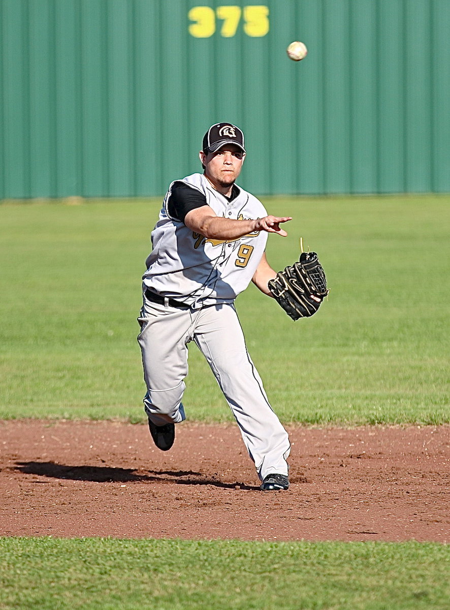 Image: Italy’s top defensive player in the game, shortstop Tyler Anderson(9), throws out one of several GPAA runners at first-base.