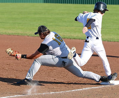 Image: First-baseman Kevin Roldan(16) serves up several catches of the day for the Gladiators who were hungry for a win.