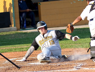 Image: Tyler Vencill(15) executes a textbook slide while going under the mitt for another Italy run.