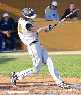 Image: Whammo! Ty Windham(12) sends the feathers flying after this monster drive into the Eagles’ outfield.