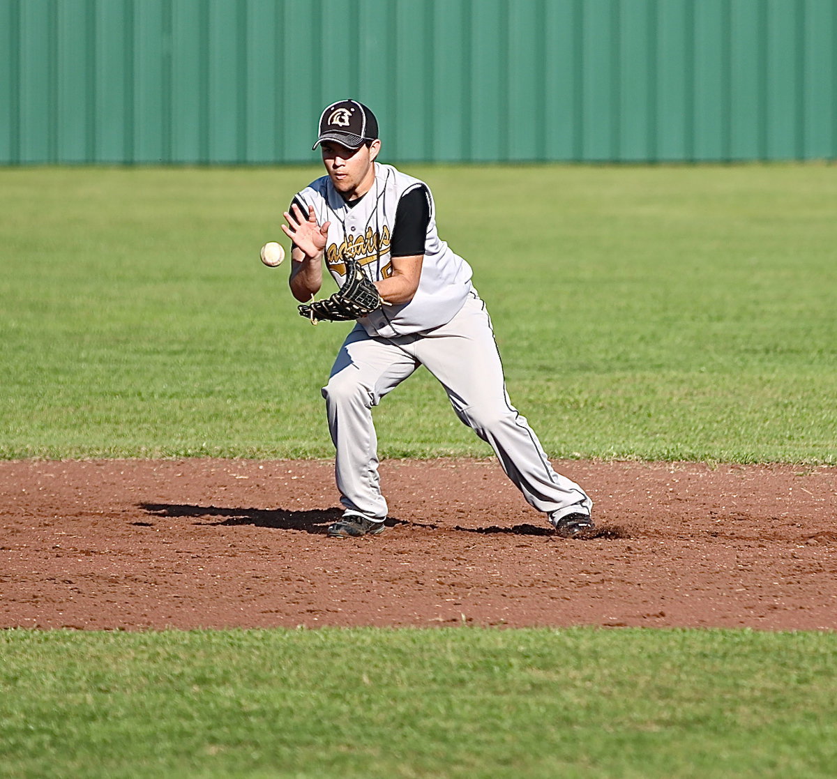 Image: Shortstop, Tyler Anderson(9) plays a high ground ball and then throws to first-base for the out….again.