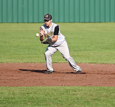 Image: Shortstop, Tyler Anderson(9) plays a high ground ball and then throws to first-base for the out….again.