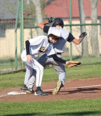 Image: Italy’s Levi McBride(1) reaches third-base in time to beat the throw.