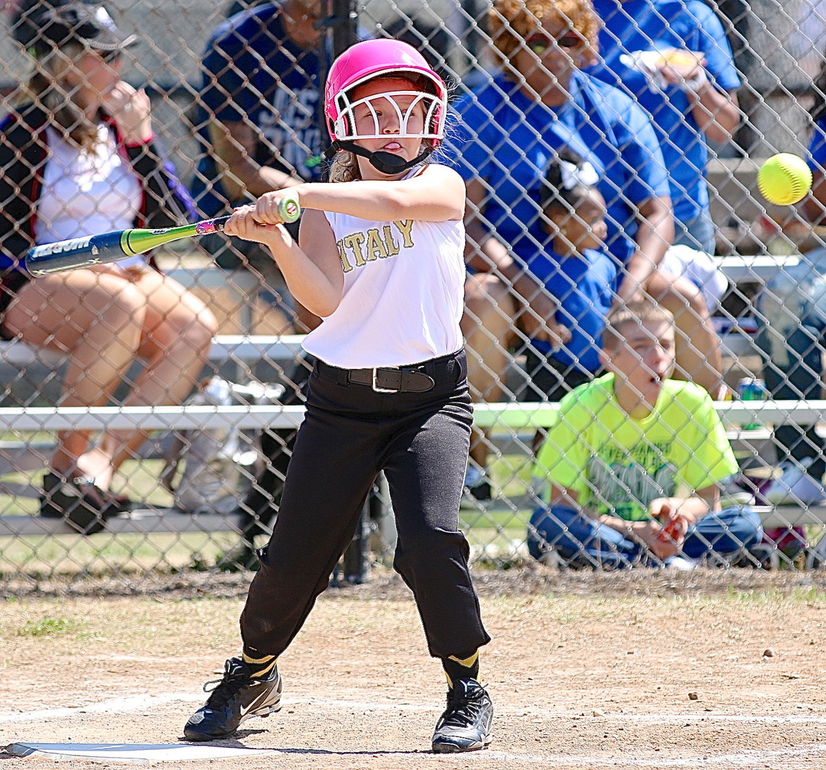 Image: Kiara Bueno chews gum and hits the ball at the same time. I can’t even walk and chew gum at the same time.