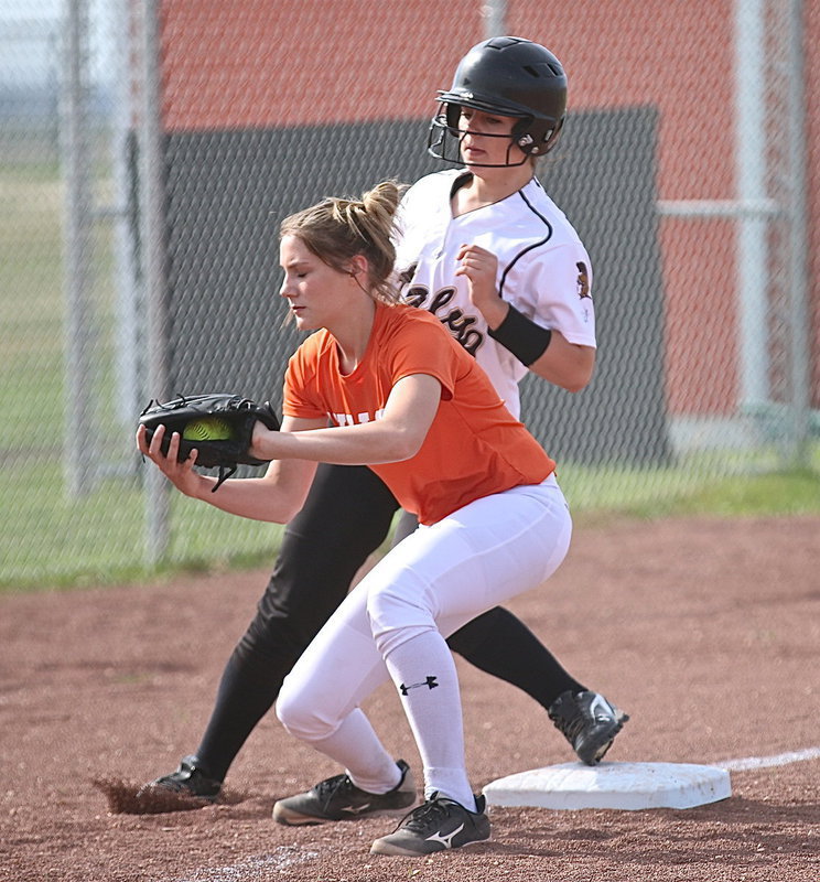 Image: Lady Gladiator Brooke DeBorde(17) reaches third-base before Avalon could make the tag.