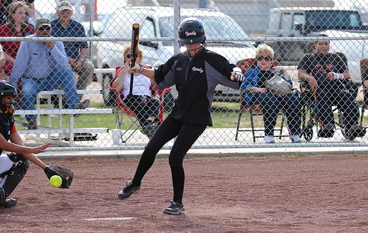 Image: Lady Gladiator Cassdiy Childers is clipped by an Avalon pitch with the walks beginning to mount against the Lady Eagles.