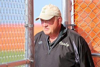 Image: Sunlight doesn’t shine in his eyes out of respect. He is the most interesting man in the softball world—Coach Johnny Jones.
