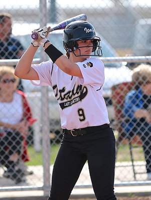 Image: Lillie Perry(9) steps up to the plate with a look of determination.