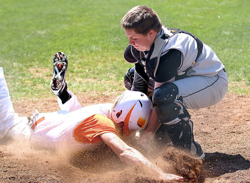 Image: Italy catcher John Escamilla(7) gets down and dirty to make the tag for an out at home plate to secure a 14-0 shutout by the Gladiators over district rival Avalon.