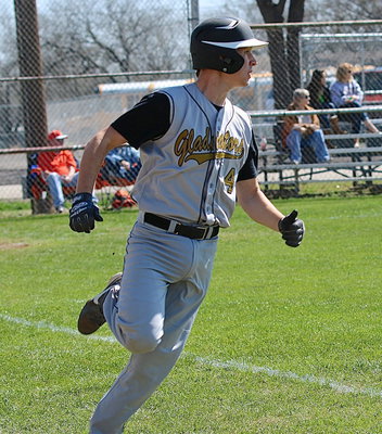 Image: Ryan Connor(4) turns on the jets as he rounds first-base.