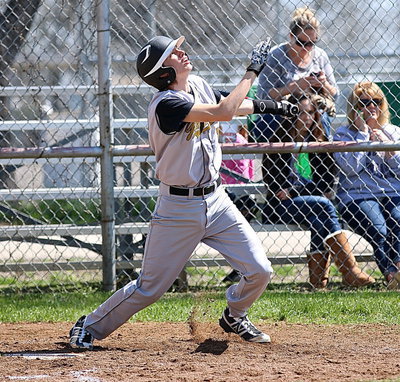 Image: Ty Windham(12) hits a double for the Gladiator Hitmen.