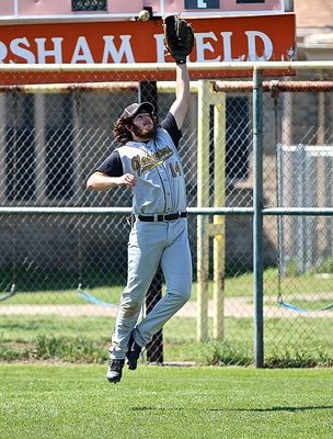 Image: Kyle Fortenberry(14) is looking good while warming up between innings.