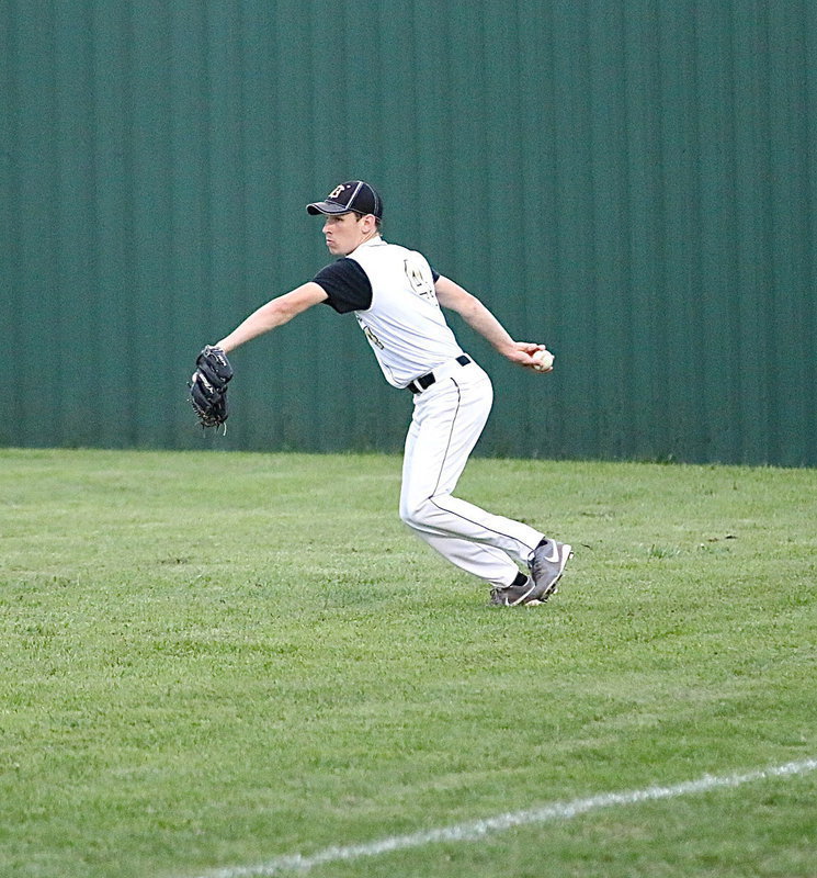 Image: Ryan Connor(4) tracks down a blooper into right field with Milford striking the first blow on the scoreboard.