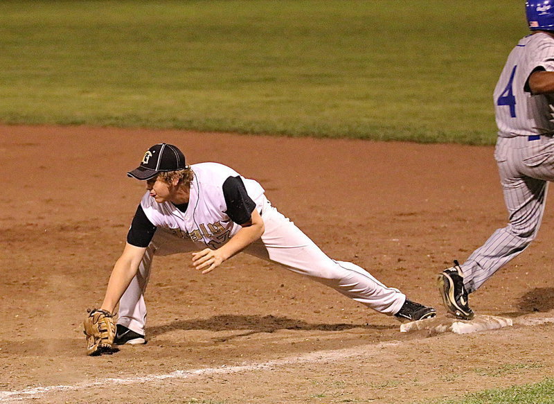 Image: Bailey Walton(17) makes the stretch for an out after taking over at first-base for the injured Kevin Roldan.