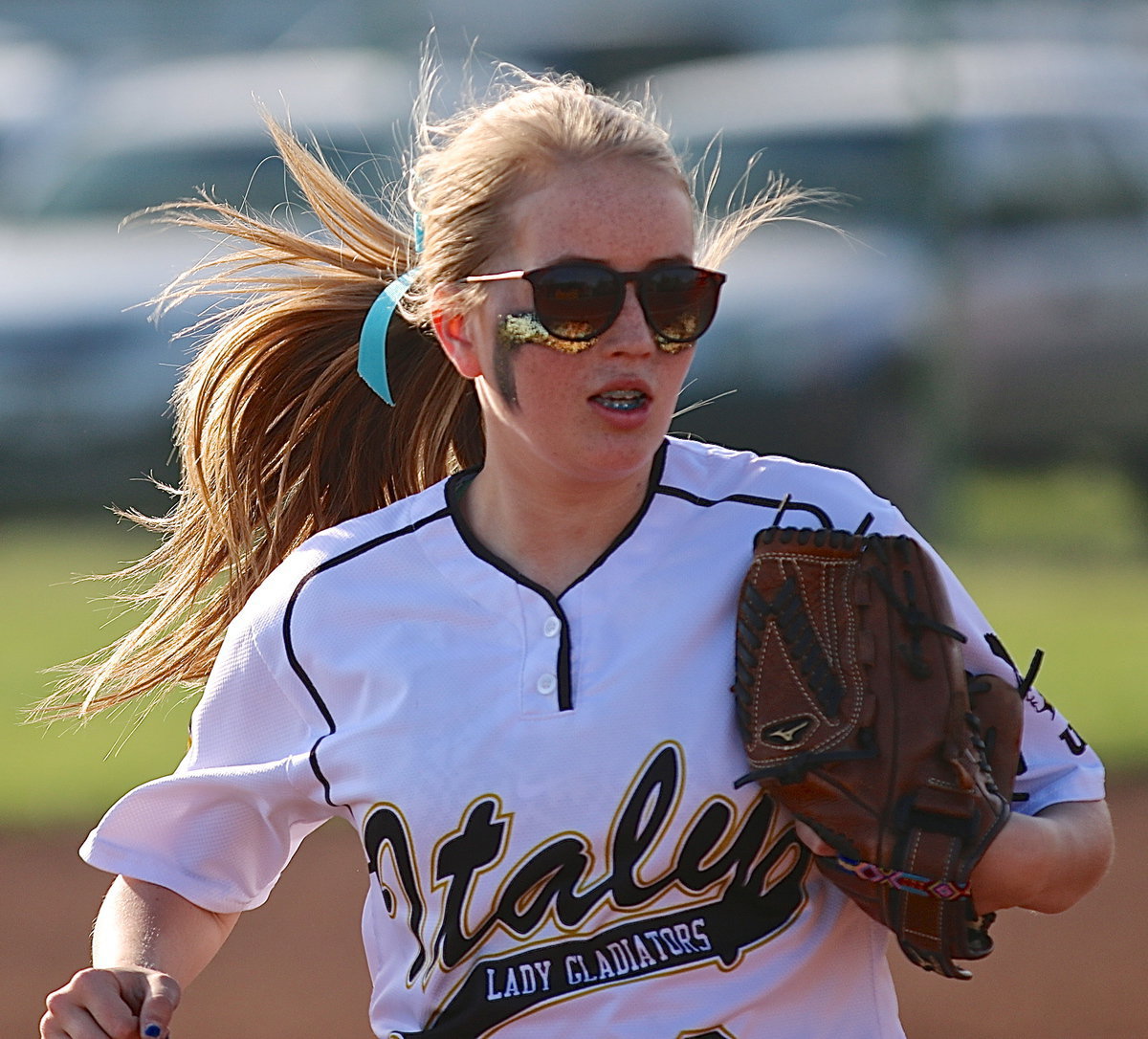 Image: Hannah Washington(8) hustles into position at third-base.