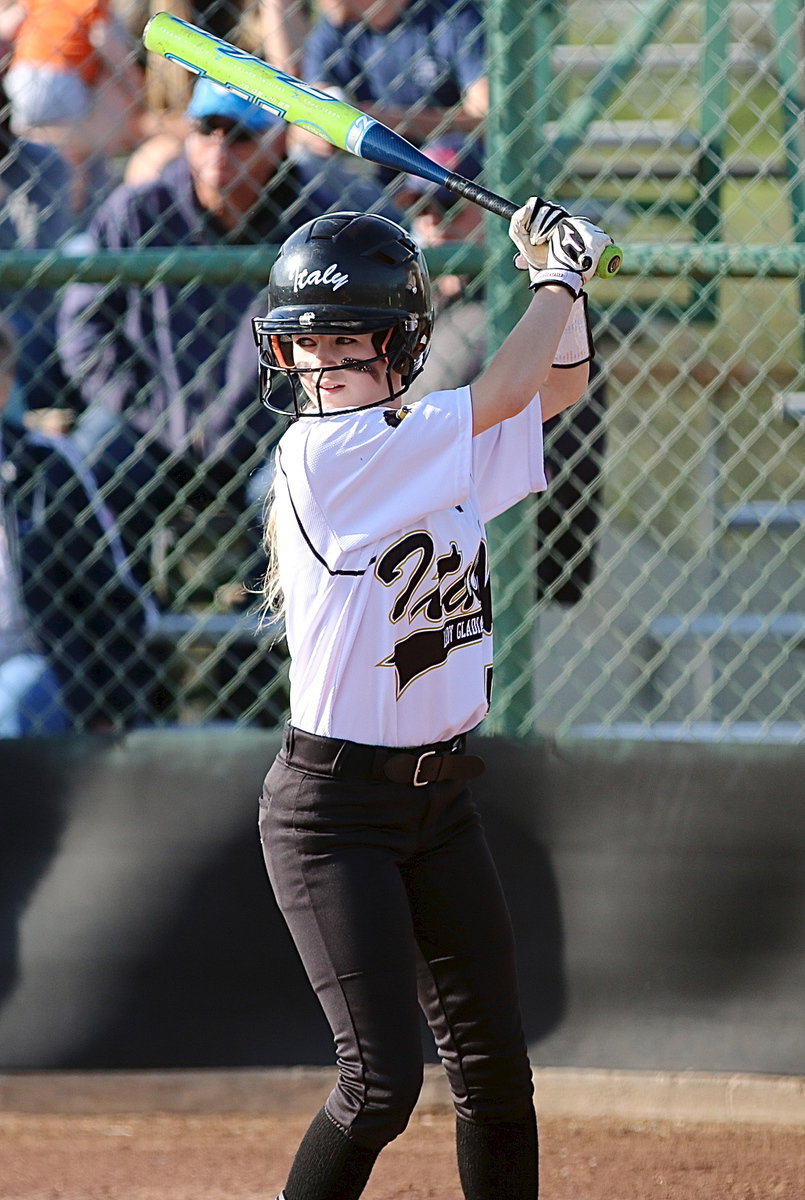 Image: Britney Chambers(4) slap hits her way onto first-base.