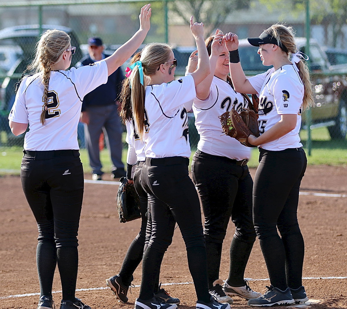 Image: The infield gathers in support of each other.