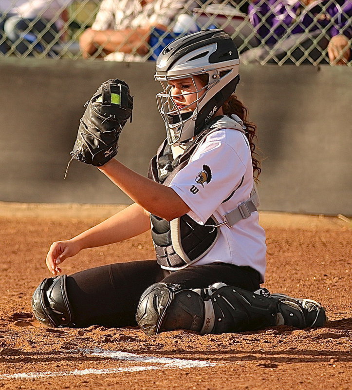 Image: Catcher Lillie Perry(9) has her own unique style when hauling a strike.