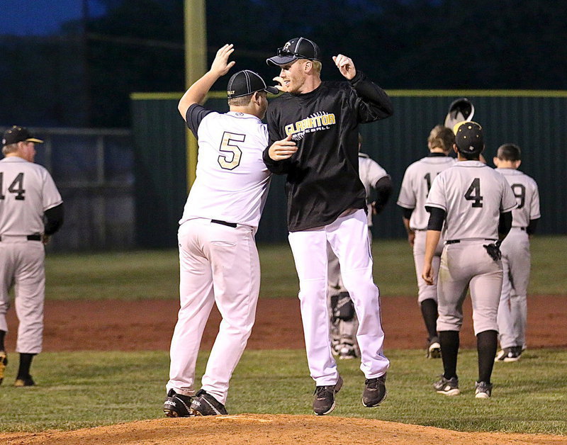 Image: With Itasca walking off in defeat, Zain Byers(5) and Italy Baseball head coach Jon Cady celebrate their second district shutout with a 9-0 win over the Wampus Cats. Italy improves to 4-0 in district play.