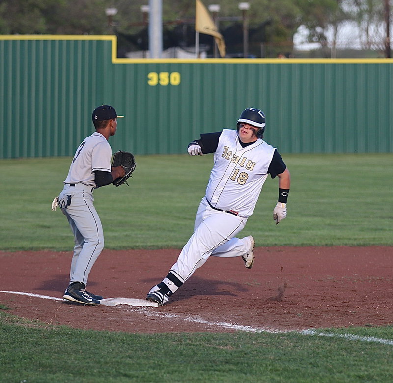 Image: John Byers(18) turns around third-base and heads home as he gets the green light from head coach Jon Cady to go for it.