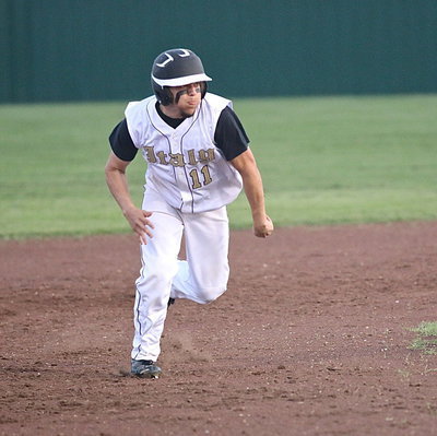 Image: Tyler Anderson(11) motors from second-base to third and then to home.