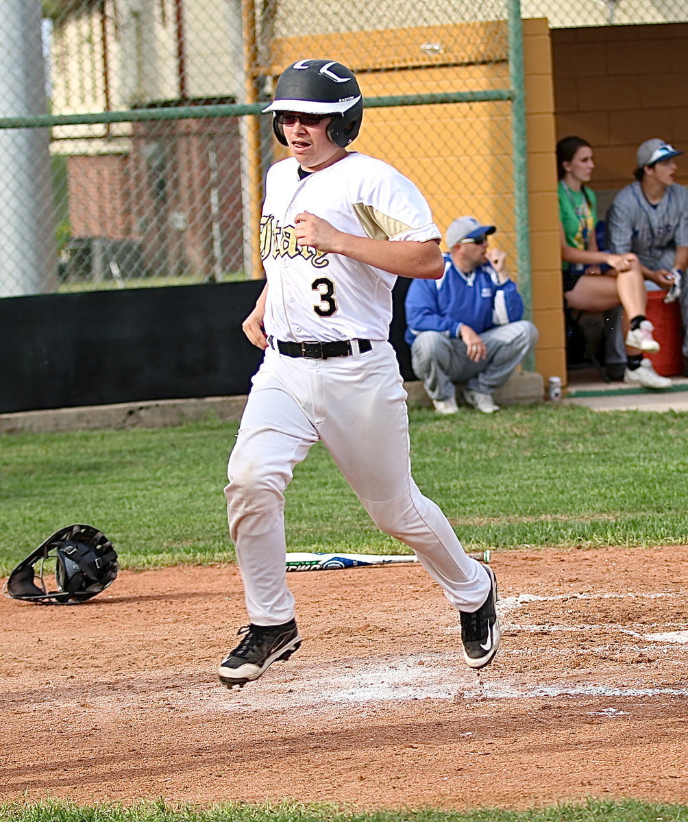 Image: Eli Garcia(3) crosses home plate thanks to a double from teammate Austin Crawford.