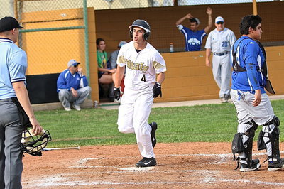 Image: Mason Womack(4) crosses home plate thanks to double from teammate Austin Crawford.