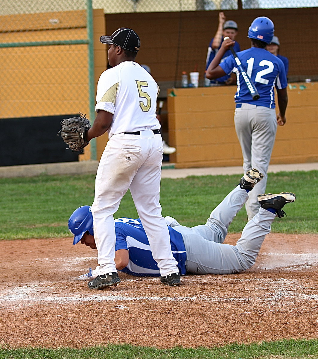 Image: Milford breaks the tie on a wild pitch to retie the contest 7-7 in the top of the fifth-inning.