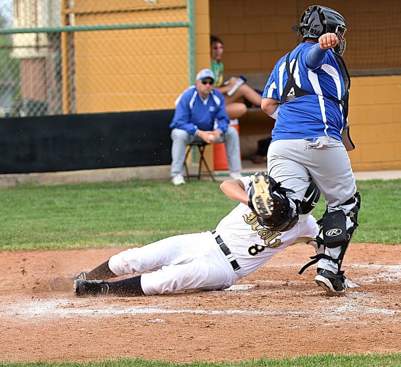 Image: Italy’s Joe Celis(8) slides across home plate for game winning run!