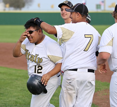 Image: Pedro Salazar(12) is then congratulated by his teammates for coming thru for the JV Gladiator in dramatic fashion.