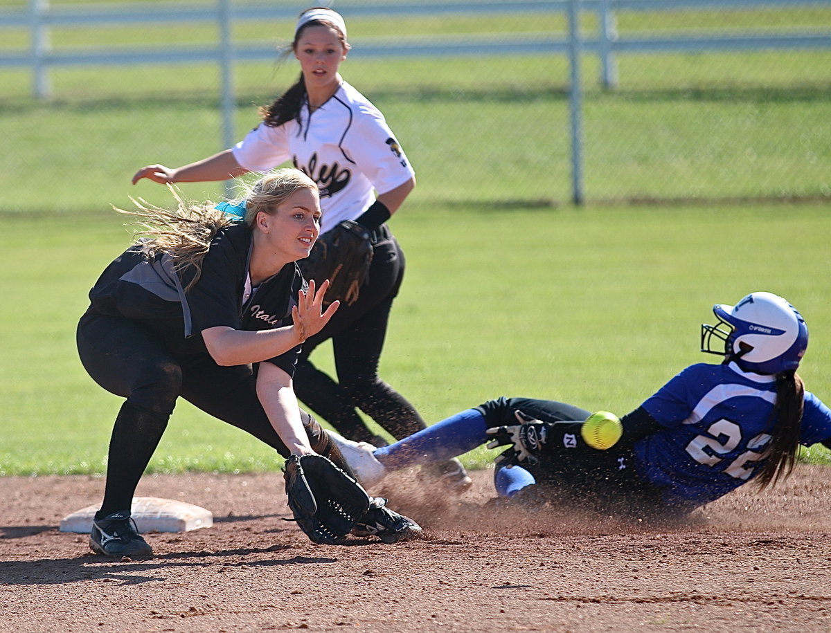 Image: Frost’s Hillary Schwartz out slides a throw-down attempt by Italy with Madison Washington(2) making the catch and Bailey Eubank(1) backing her up.