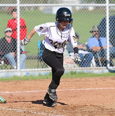 Image: Britney Chambers(4) slap hits her way onto base for Italy.