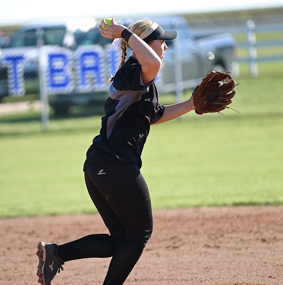 Image: Jaclynn Lewis(15) covers a grounder hit back to the mound and then throws to teammate Paige Westbrook covering first-base for an out.