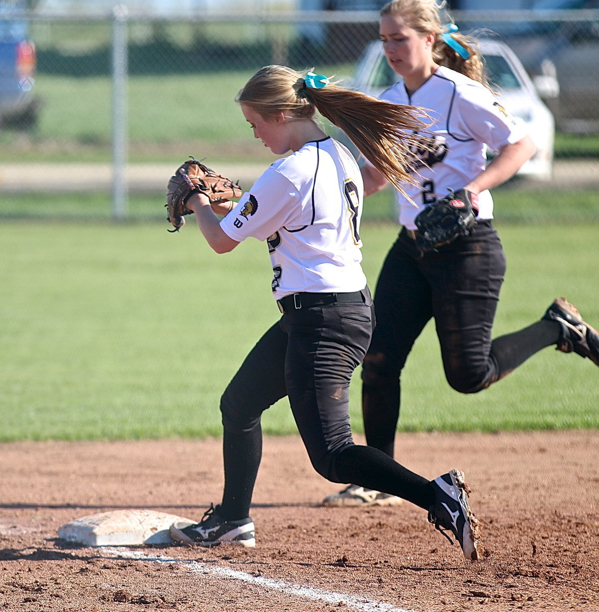 Image: Italy’s third-baseman Hannah Washington(8) secures a ground ball and then steps on third base for the force out to end the top of the fifth-inning.