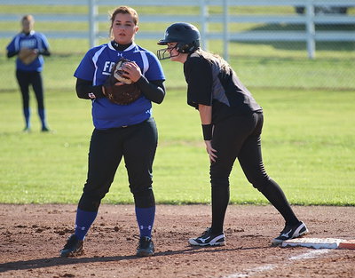 Image: Kelsey Neslon(14) gets on base with a solid hit to first-base that goes Nelson’s way.