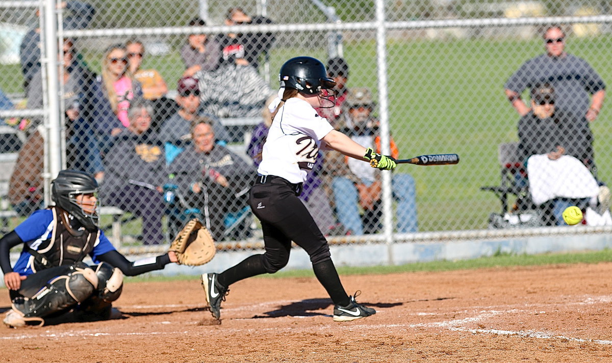 Image: Tara Wallis(5) drives a hard hit ground ball toward first-base to score teammate Lillie Perry from third to give Italy their first lead, 4-3 in the top of the seventh.