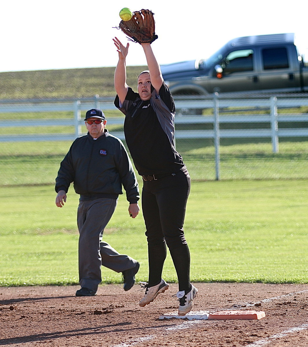 Image: First-baseman Paige Westbrook(10) with the hops as she catches a throw from catcher Lillie Perry for an out. What a day for Italy’s senior!