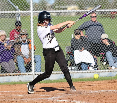Image: Hannah Washington(8) moves teammate Lizzy Garcia to third-base.