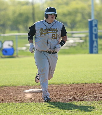 Image: John Byers(21) rounds second-base on his way to completing his over-the fence homerun lap against the Frost Polar Bears. It was the second homer in consecutive games for J.B.