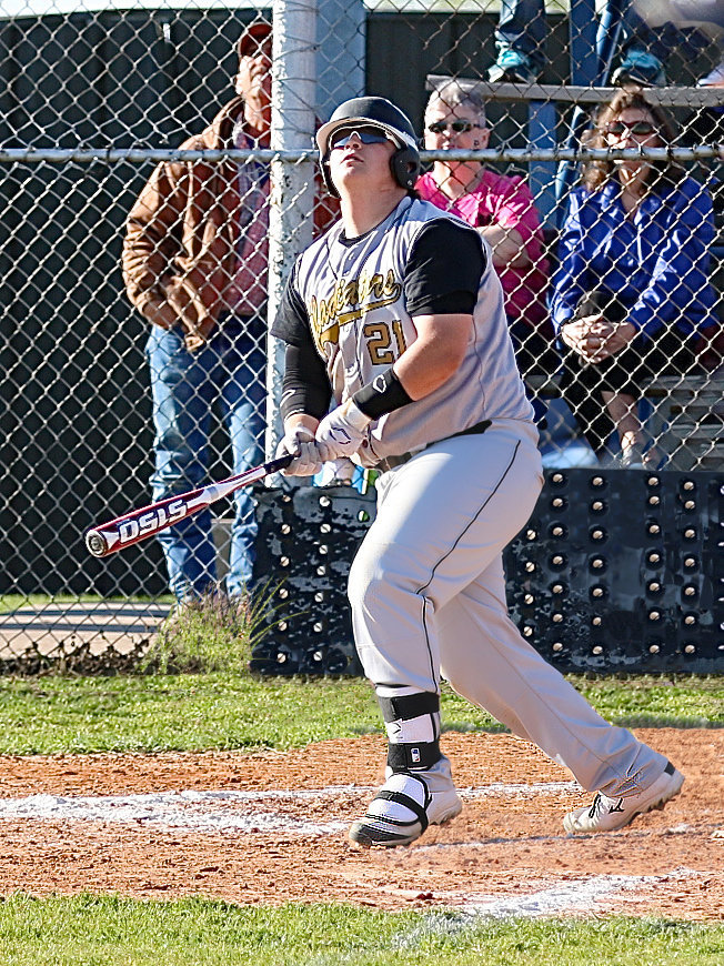 Image: Junior Gladiator hitman John Byers(21) knows it, as his homerun blast sails over the left field fence and thru the uprights of the football field’s goal post. It was a 2 run exclamation point on a 17-4 Italy win over Frost.