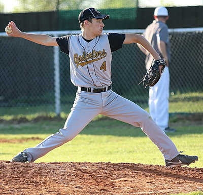 Image: Sophomore pitcher Ryan Connor(4) with a cobra like pitch for a strike.