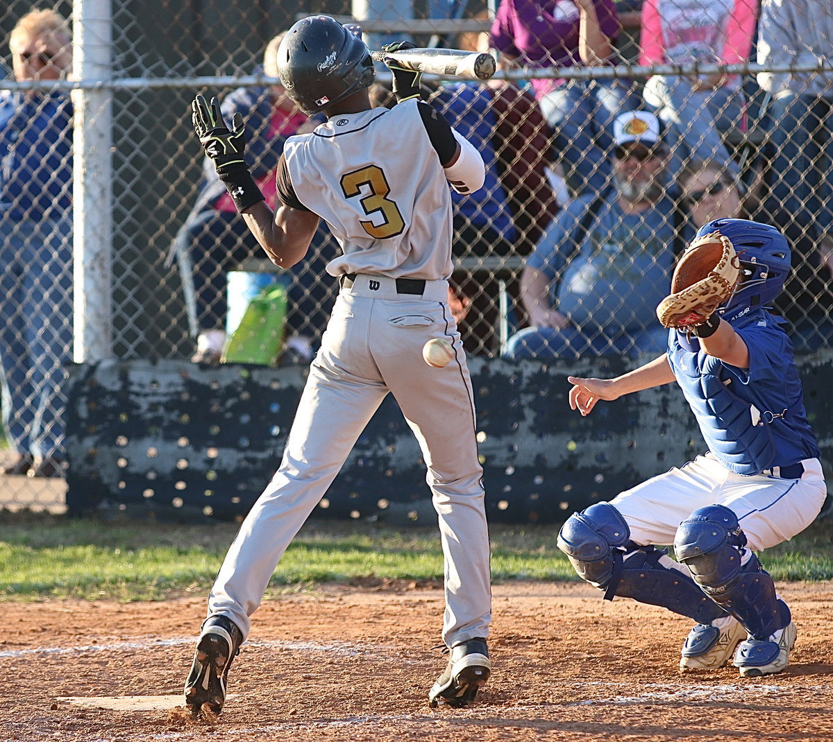 Image: Senior Eric Carson(3) is unable to avoid a pitch hitting him in the back.