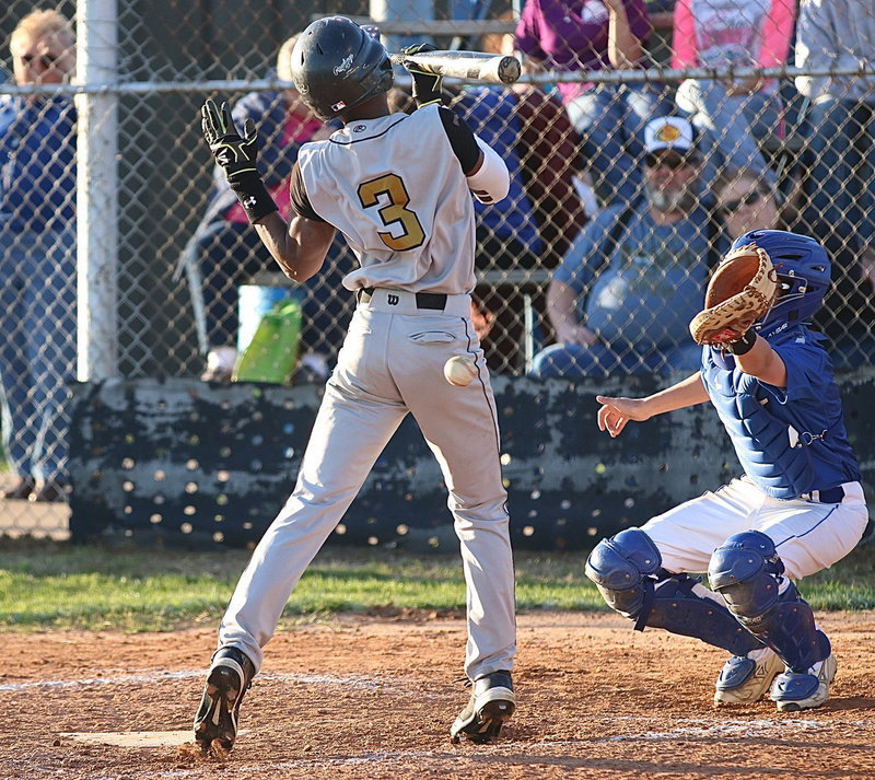 Image: Senior Eric Carson(3) is unable to avoid a pitch hitting him in the back.