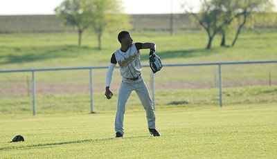 Image: Eric Carson(3) warms up in center field.