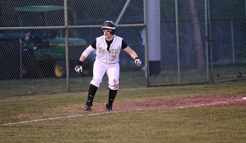 Image: John Escamilla(7) puts on the brakes down the third base line.