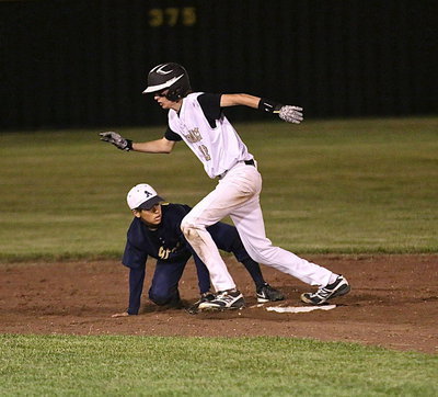 Image: After an overthrow, Ty Windham(12) makes his way to the next base. Go, mullet-man, go!