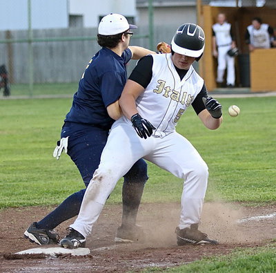 Image: The Eagle pitcher forces Zain Byers(5) back to third.