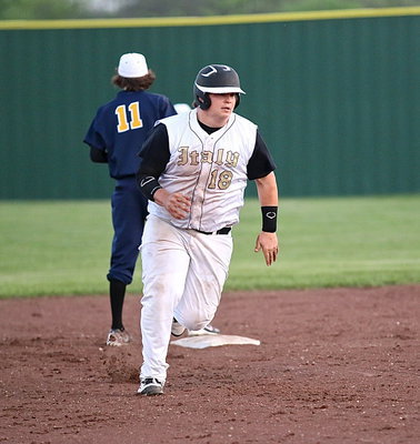 Image: Junior Gladiator John Byers(18) reaches home all the way from first-base thanks to a 2 run home run shot from teammate Kyle Fortenberry.