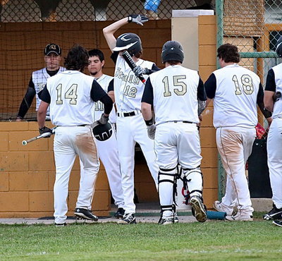 Image: Kyle Fortenberry(14) gets congratulated by teammates after recording his first homer of the 2014 season. It was Italy’s fourth home run ball this season, their third inside-the-park accomplishment.