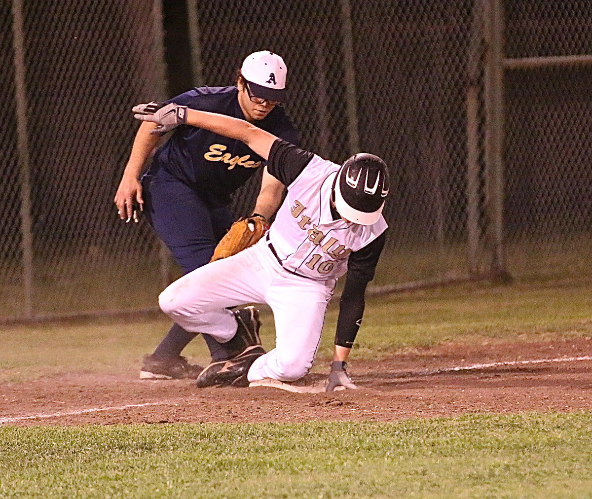 Image: Junior Gladiator Cody Boyd(10) beats the Eagle throw to reach third-base.